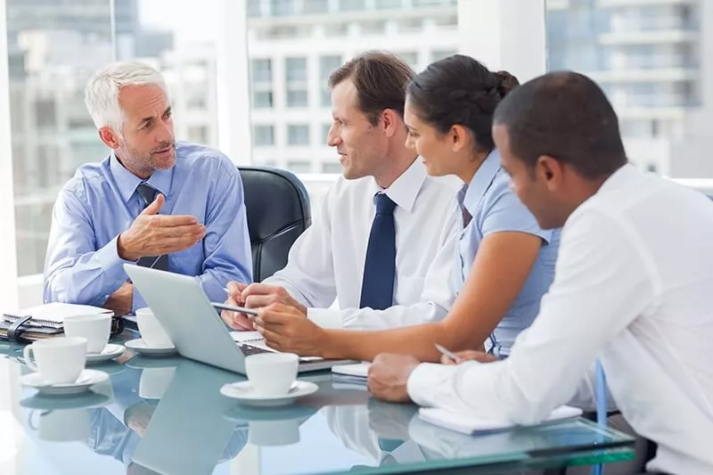 several men in a business meeting